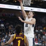 Utah State's Quinn Taylor (10) shoots over Arizona State's Remy Martin during the first half of an NCAA college basketball game Wednesday, Nov. 21, 2018, in Las Vegas. (AP Photo/John Locher)