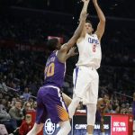Los Angeles Clippers' Danilo Gallinari (8) shoots over Phoenix Suns' Josh Jackson during the first half of an NBA basketball game Wednesday, Nov. 28, 2018, in Los Angeles. (AP Photo/Marcio Jose Sanchez)