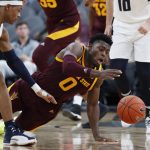 Arizona State 's Luguentz Dort, right, and Utah State's John Knight III scramble for the ball during the second half of an NCAA college basketball game Wednesday, Nov. 21, 2018, in Las Vegas. (AP Photo/John Locher)