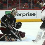 Arizona Coyotes goaltender Antti Raanta, left, gives up a short-handed goal to Colorado Avalanche J.T. Compher as Avalanche center Nathan MacKinnon (29) looks on during the first period of an NHL hockey game Friday, Nov. 23, 2018, in Glendale, Ariz. (AP Photo/Ross D. Franklin)