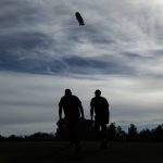 Phil Mickelson, left, and Tiger Woods walk up the second fairway during a golf match at Shadow Creek golf course, Friday, Nov. 23, 2018, in Las Vegas. (AP Photo/John Locher)