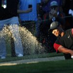 Tiger Woods hits out of a bunker on the 16th hole during a golf match against Phil Mickelson at Shadow Creek golf course, Friday, Nov. 23, 2018, in Las Vegas. (AP Photo/John Locher)