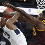 Arizona State 's Romello White, right, blocks a shot by Utah State's John Knight III during the first half of an NCAA college basketball game Wednesday, Nov. 21, 2018, in Las Vegas. (AP Photo/John Locher)