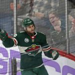 Fans celebrate along with Minnesota Wild's Jason Zucker after he scored a goal against the Arizona Coyotes during the second period of an NHL hockey game Tuesday, Nov. 27, 2018, in St. Paul, Minn. (AP Photo/Jim Mone)