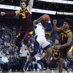 Utah State's John Knight III (3) is fouled while shooting against Arizona State's Mickey Mitchell, left, and Remy Martin during the first half of an NCAA college basketball game Wednesday, Nov. 21, 2018, in Las Vegas. (AP Photo/John Locher)