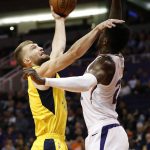 Indiana Pacers forward Domantas Sabonis shoots over Phoenix Suns center Deandre Ayton, right, during the first half of an NBA basketball game, Tuesday, Nov. 27, 2018, in Phoenix. (AP Photo/Matt York)