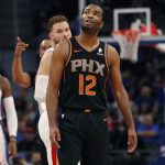 Phoenix Suns forward T.J. Warren (12) looks toward the scoreboard after a second technical foul during the first half of an NBA basketball game against the Detroit Pistons, Sunday, Nov. 25, 2018, in Detroit. Warren fouled out of the game. (AP Photo/Carlos Osorio)