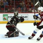 Colorado Avalanche left wing J.T. Compher (37) beats Arizona Coyotes goaltender Antti Raanta (32) for a short-handed goal during the first period of an NHL hockey game Friday, Nov. 23, 2018, in Glendale, Ariz. (AP Photo/Ross D. Franklin)