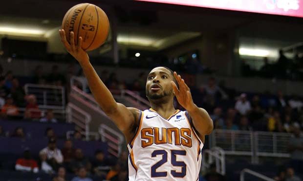 Phoenix Suns forward Mikal Bridges (25) drives by San Antonio Spurs guard Marco Belinelli during th...