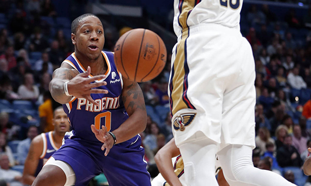 Phoenix Suns guard Isaiah Canaan (0) passes around New Orleans Pelicans forward Anthony Davis (23) ...