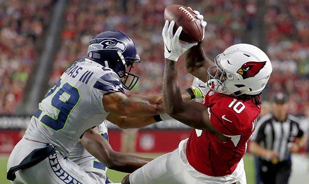 Arizona Cardinals wide receiver Chad Williams (10) makes the catch as Seattle Seahawks defensive ba...