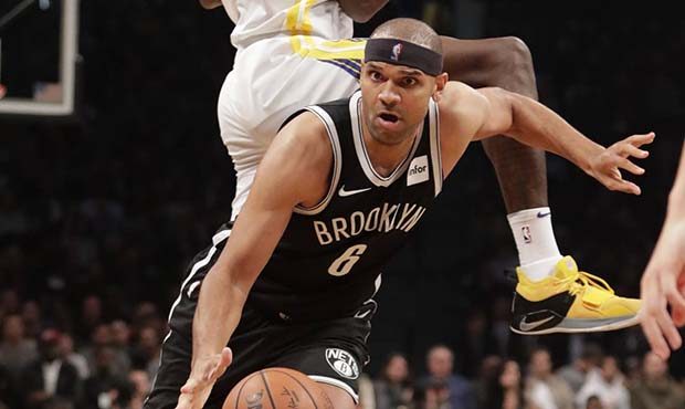 Brooklyn Nets' Jared Dudley (6) drives past Golden State Warriors' Jordan Bell (2) during the secon...