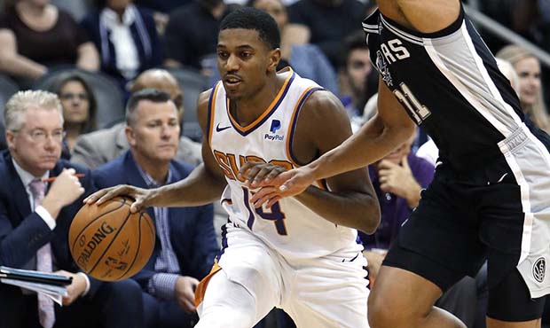 Phoenix Suns guard De'Anthony Melton drives on San Antonio Spurs guard Bryn Forbes (11) during the ...
