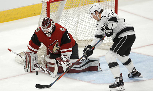 Arizona Coyotes goalie Hunter Miska (1) makes a save on a shot by Los Angeles Kings right wing Tyle...
