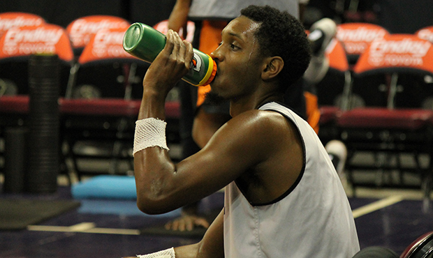 Northern Arizona Suns player A.J. Mosby tries to rehydrate during practice. (Photo courtesy Jake Wi...