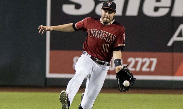 Arizona Diamondbacks centerfielder A.J. Pollock slides in the first inning to come up with the ball...