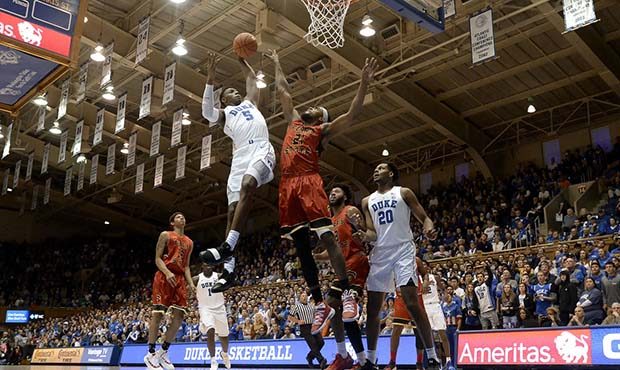 Duke's RJ Barrett (5) shoots as Ferris State's Adway Taylor (21) defends in the first half of an NC...