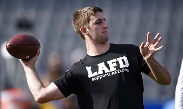 Arizona Cardinals quarterback Josh Rosen warms up before the start of an football game against the ...