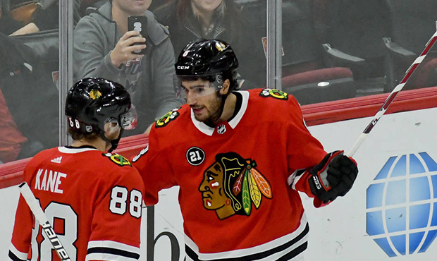 Chicago Blackhawks right wing Patrick Kane (88) and center Nick Schmaltz, right, celebrate after Sc...