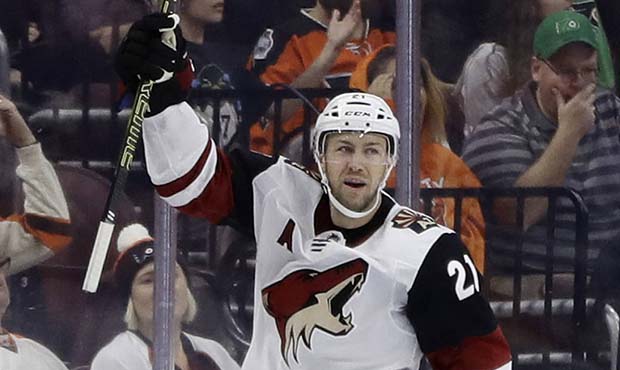 Arizona Coyotes' Derek Stepan celebrates after scoring a goal during the second period of an NHL ho...