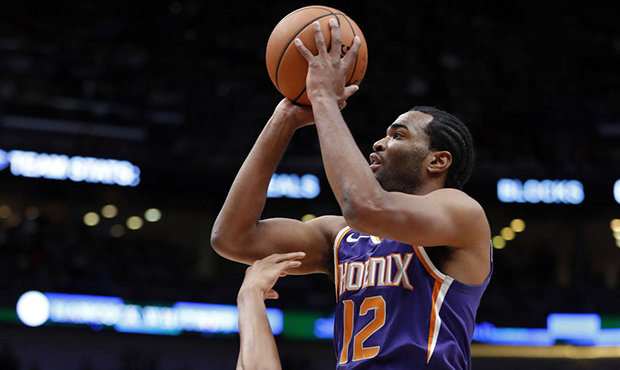 Phoenix Suns forward TJ Warren (12) shoots as he is fouled byNew Orleans Pelicans forward Wesley Jo...