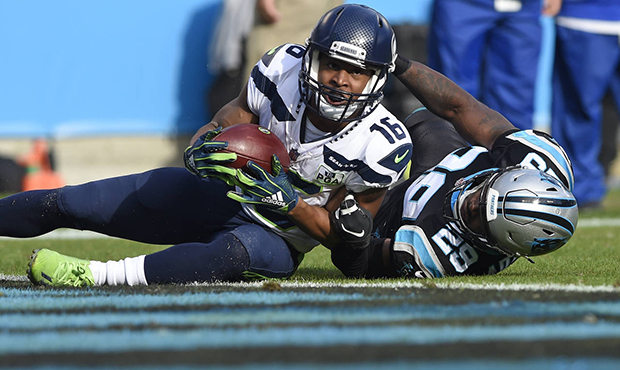 Seattle Seahawks' Tyler Lockett (16) catches a touchdown pass against Carolina Panthers' Mike Adams...