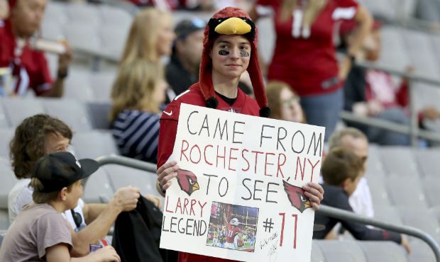 An Arizona Cardinals fan holds a sign prior to an NFL football game against the Los Angeles Rams, S...