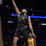 Nevada forward Caleb Martin, left, shoots as Arizona State forward Romello White watches during the first half of an NCAA college basketball game at the Basketball Hall of Fame Classic on Friday, Dec. 7, 2018, in Los Angeles. (AP Photo/Mark J. Terrill)