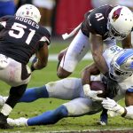 Detroit Lions running back Theo Riddick (25) is hit by Arizona Cardinals free safety Antoine Bethea (41) as linebacker Gerald Hodges (51) pursues during the second half of NFL football game, Sunday, Dec. 9, 2018, in Glendale, Ariz. (AP Photo/Ross D. Franklin)