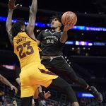 Nevada guard Jazz Johnson, right, shoots as Arizona State forward Romello White defends during the first half of an NCAA college basketball game at the Basketball Hall of Fame Classic on Friday, Dec. 7, 2018, in Los Angeles. (AP Photo/Mark J. Terrill)