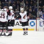 New York Rangers goaltender Henrik Lundqvist, right, reacts as Arizona Coyotes defenseman Jordan Oesterle (82) celebrates after scoring a goal during the second period of an NHL hockey game, Friday, Dec. 14, 2018, at Madison Square Garden in New York. (AP Photo/Mary Altaffer)