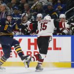 Buffalo Sabres defenseman Lawrence Pilut (24) and Arizona Coyotes forward Brad Richardson (15) collide during the second period of an NHL hockey game, Thursday, Dec. 13, 2018, in Buffalo N.Y. (AP Photo/Jeffrey T. Barnes)