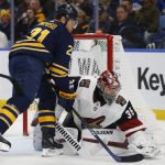 Buffalo Sabres forward Kyle Okposo (21) is stopped by Arizona Coyotes goalie Darcy Kuemper (35) during the first period of an NHL hockey game, Thursday, Dec. 13, 2018, in Buffalo N.Y. (AP Photo/Jeffrey T. Barnes)