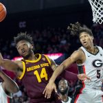Arizona State forward Kimani Lawrence (14) and Georgia forward JoJo Toppin vie for a rebound during the first half of an NCAA college basketball game Saturday, Dec. 15, 2018, in Athens, Ga. (AP Photo/John Amis)