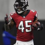 Atlanta Falcons linebacker Deion Jones (45) runs back to the bench after he intercepted the ball and ran it in for a touchdown against the Arizona Cardinals during the first half of an NFL football game, Sunday, Dec. 16, 2018, in Atlanta. (AP Photo/Danny Karnik)