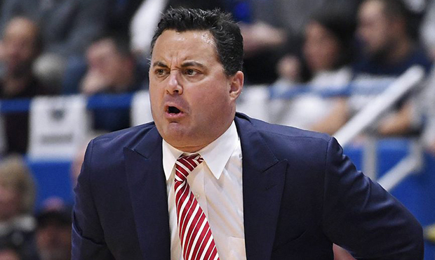 Arizona head coach Sean Miller calls out to his team during the first half of an NCAA college baske...