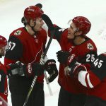 Arizona Coyotes left wing Lawson Crouse (67) celebrates his goal against the Washington Capitals with defenseman Alex Goligoski (33), center Nick Cousins (25) and right wing Josh Archibald (45) during the second period of an NHL hockey game Thursday, Dec. 6, 2018, in Glendale, Ariz. (AP Photo/Ross D. Franklin)