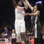 Phoenix Suns' Deandre Ayton (22) shoots over Brooklyn Nets' Jarrett Allen during the first half of an NBA basketball game Sunday, Dec. 23, 2018, in New York. (AP Photo/Frank Franklin II)