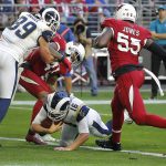 Los Angeles Rams quarterback Jared Goff (16) scores a touchdown against the Arizona Cardinals during the first half of an NFL football game, Sunday, Dec. 23, 2018, in Glendale, Ariz. (AP Photo/Rick Scuteri)