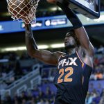 Phoenix Suns center Deandre Ayton (22) dunks against the Oklahoma City Thunder in the second half during an NBA basketball game, Friday, Dec. 28, 2018, in Phoenix. (AP Photo/Rick Scuteri)