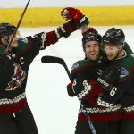
              Arizona Coyotes defenseman Jakob Chychrun (6) celebrates his goal against the St. Louis Blues with Coyotes defenseman Oliver Ekman-Larsson, left, and center Clayton Keller, middle, during the first period of an NHL hockey game, Saturday, Dec. 1, 2018, in Glendale, Ariz. (AP Photo/Ross D. Franklin)
            