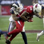 Arizona Cardinals tight end Ricky Seals-Jones (86) is hit by Los Angeles Rams inside linebacker Mark Barron (26) during the first half of an NFL football game, Sunday, Dec. 23, 2018, in Glendale, Ariz. (AP Photo/Ross D. Franklin)