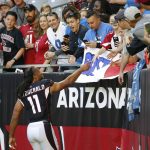 Arizona Cardinals wide receiver Larry Fitzgerald (11) greets fans prior to an NFL football game against the Detroit Lions, Sunday, Dec. 9, 2018, in Glendale, Ariz. (AP Photo/Rick Scuteri)