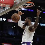 Los Angeles Lakers' LeBron James scores on a breakaway dunk against the Phoenix Suns during the second half of an NBA basketball game Sunday, Dec. 2, 2018, in Los Angeles. (AP Photo/Marcio Jose Sanchez)