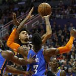 Phoenix Suns forward Kelly Oubre Jr. shoots over Oklahoma City Thunder forward Nerlens Noel (3) in the second half during an NBA basketball game, Friday, Dec. 28, 2018, in Phoenix. (AP Photo/Rick Scuteri)