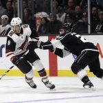 Arizona Coyotes' Nick Schmaltz (8) is defended by Los Angeles Kings' Alec Martinez during the first period of an NHL hockey game Tuesday, Dec. 4, 2018, in Los Angeles. (AP Photo/Marcio Jose Sanchez)