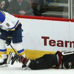 Arizona Coyotes right wing Michael Grabner, right, falls to the ice due to injury as St. Louis Blues left wing Sammy Blais, left, skates past during the first period of an NHL hockey game, Saturday, Dec. 1, 2018, in Glendale, Ariz. (AP Photo/Ross D. Franklin)
