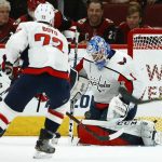 Washington Capitals goaltender Pheonix Copley (1) makes a save on a shot against the Arizona Coyotes as Capitals center Travis Boyd (72) watches during the first period of an NHL hockey game Thursday, Dec. 6, 2018, in Glendale, Ariz. (AP Photo/Ross D. Franklin)
