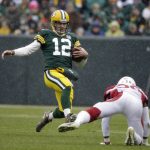 Green Bay Packers quarterback Aaron Rodgers slides to down the ball against the Arizona Cardinals during the first half of an NFL football game Sunday, Dec. 2, 2018, in Green Bay, Wis. (AP Photo/Jeffrey Phelps)