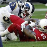 Arizona Cardinals outside linebacker Deone Bucannon (20) recovers a fumble as Los Angeles Rams center Brian Allen (55) defends during the first half of an NFL football game, Sunday, Dec. 23, 2018, in Glendale, Ariz. (AP Photo/Rick Scuteri)